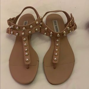 Woman’s nude and pearl sandals